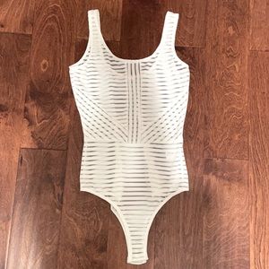 White see-through bodysuit.